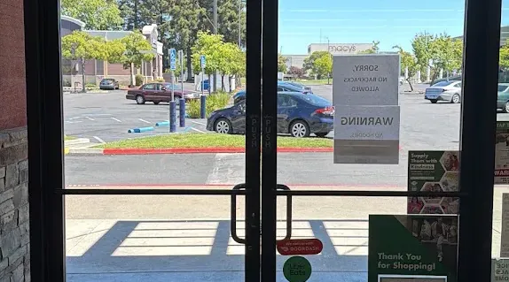 Exterior view of a glass storefront entrance.