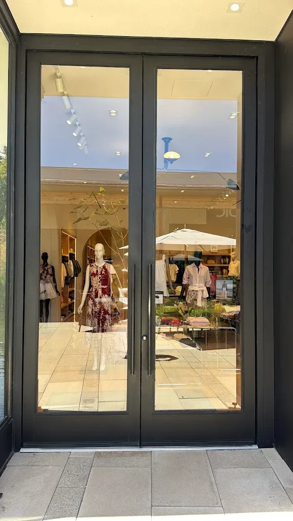 Glass double doors at a shopping-center storefront.
