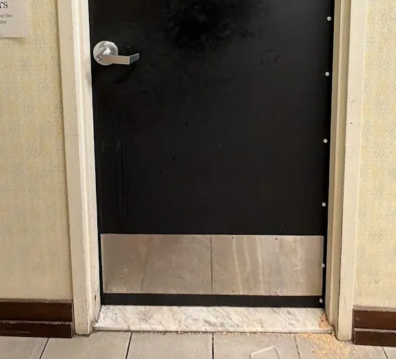 Black commercial door and lever hardware.