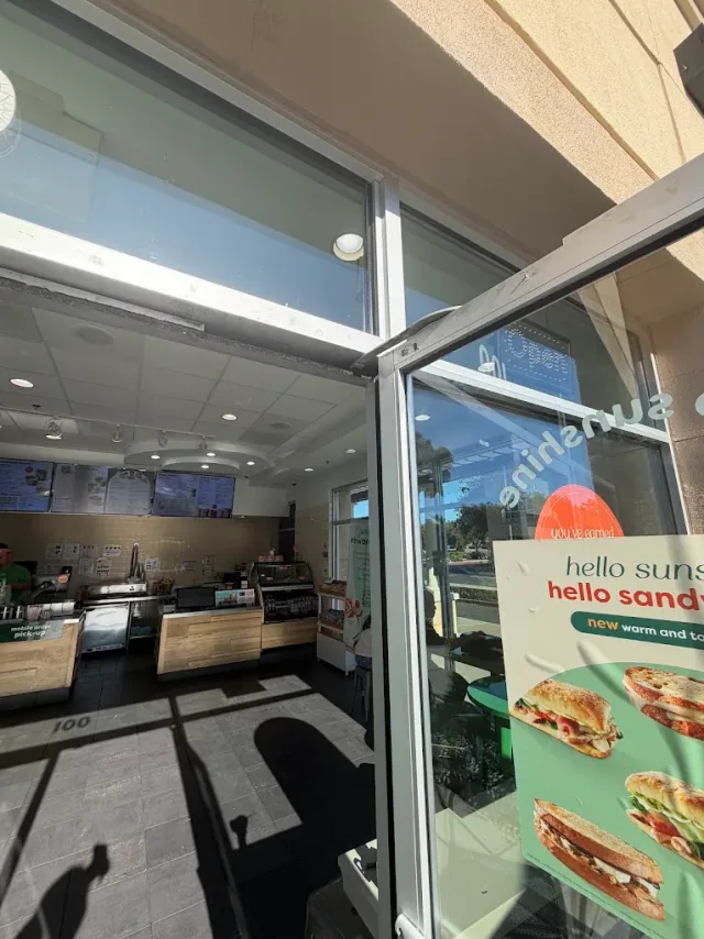 Commercial storefront interior viewed through its glass entrance.