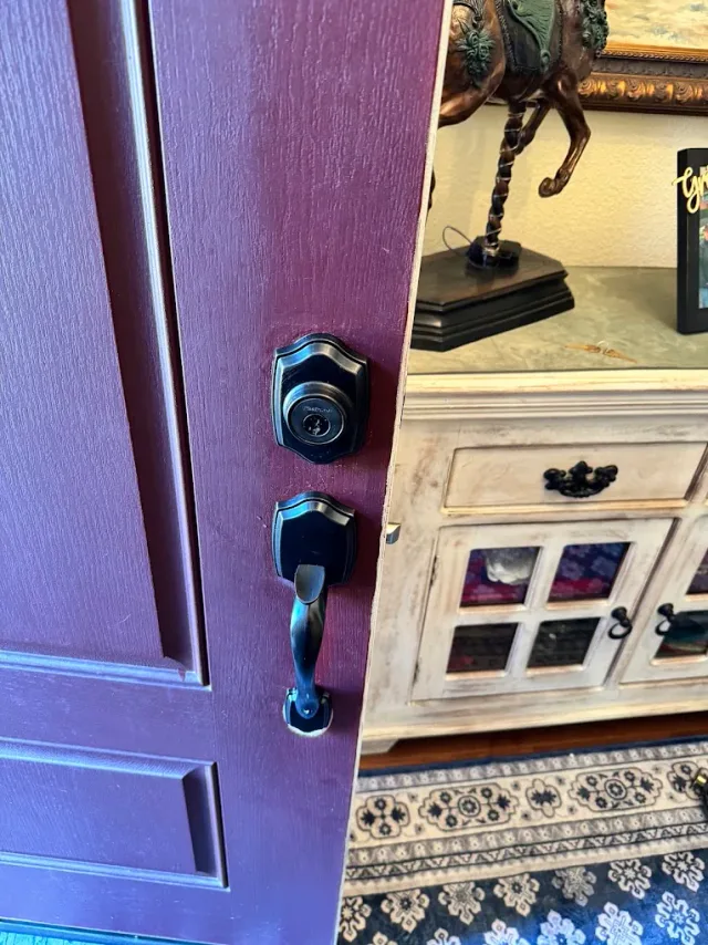 Deadbolt and lever on a residential front door.